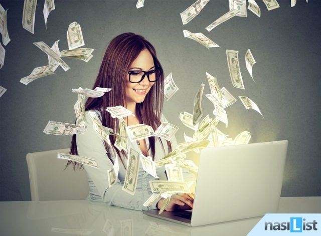Professional smart young woman using a laptop building online business